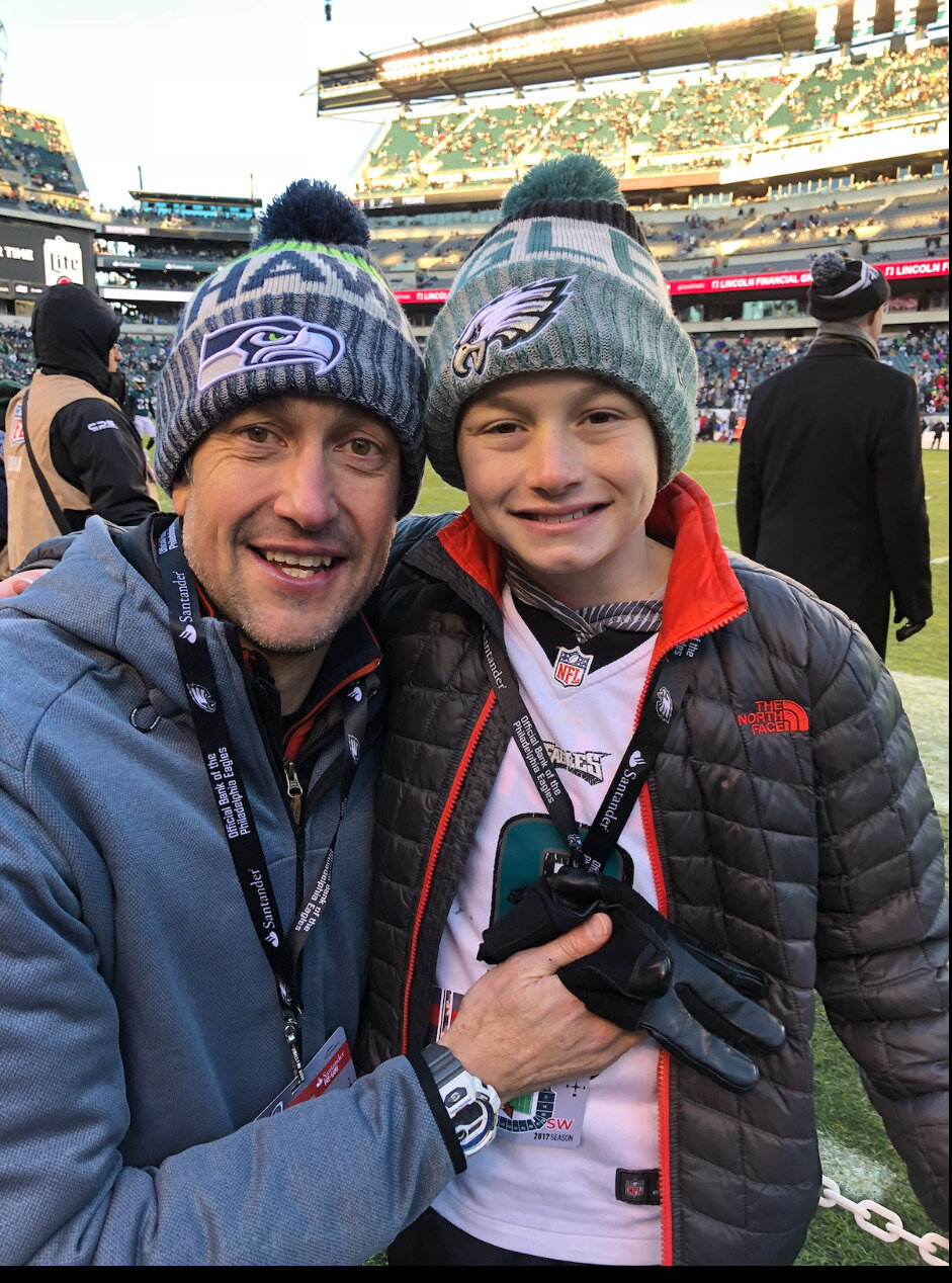 Luke with his dad at an Eagles game